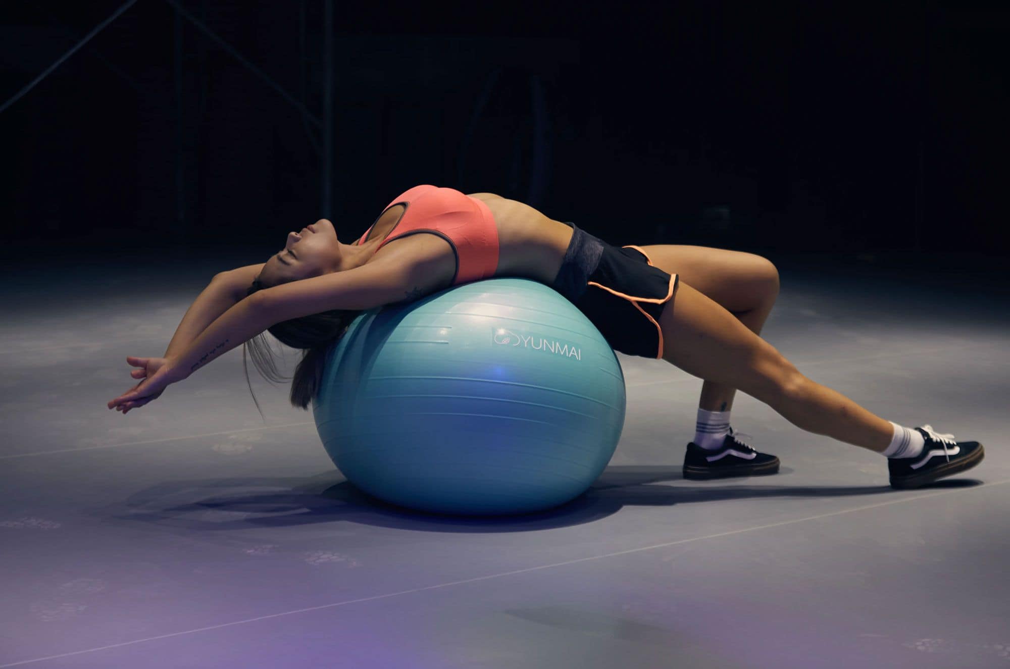 Woman Stretching Over a Gym Ball 1